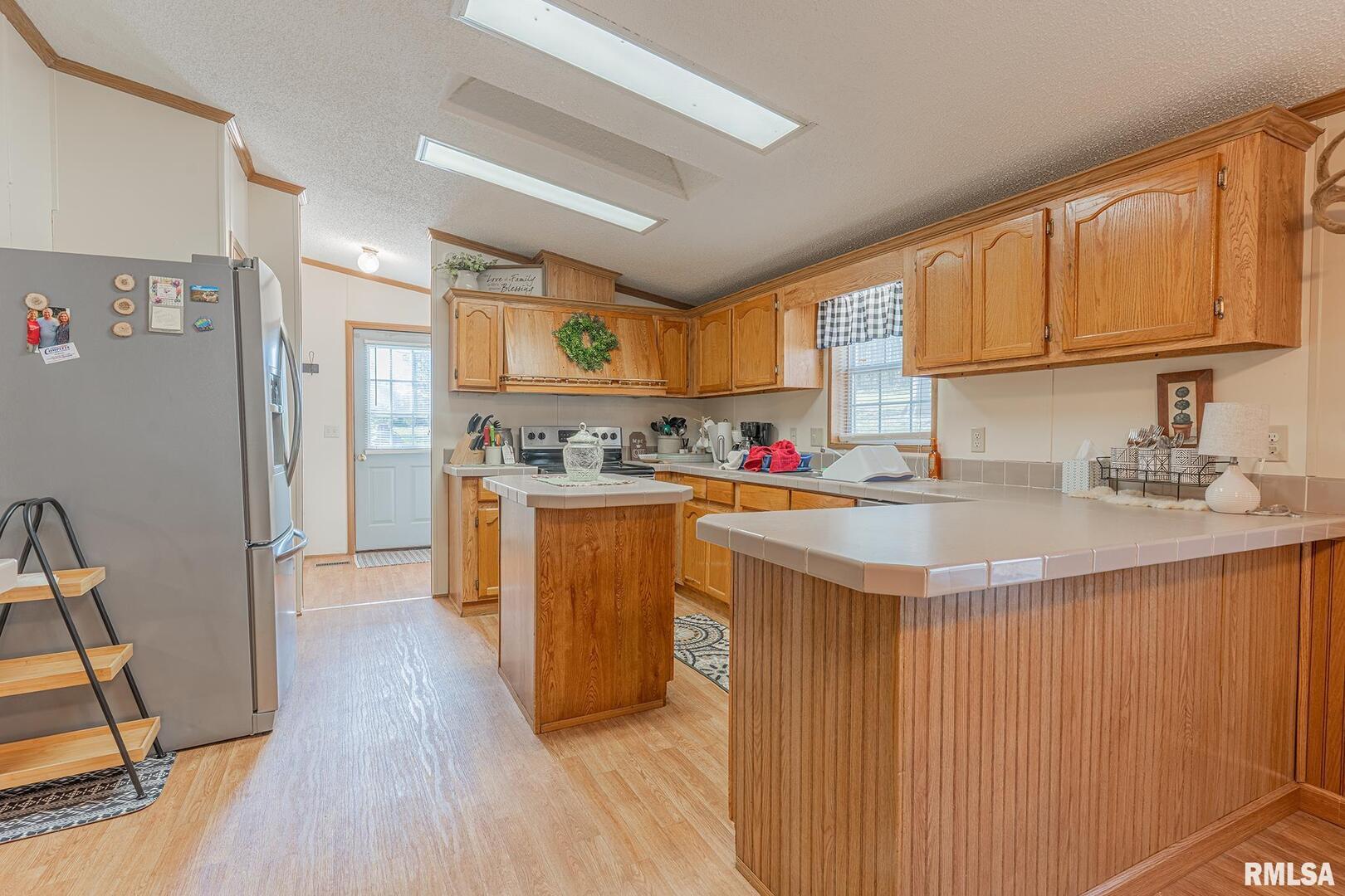 565 Dutton Chapel Road Herod, IL 62947 - Photo 40 of 54 a kitchen with stainless steel appliances granite countertop a sink stove and refrigerator