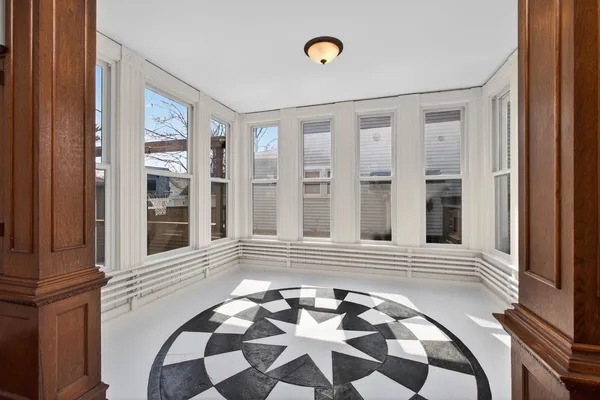 a view of an entryway with wooden floor
