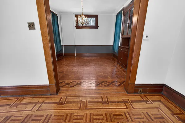 a view of a hallway with a chandelier
