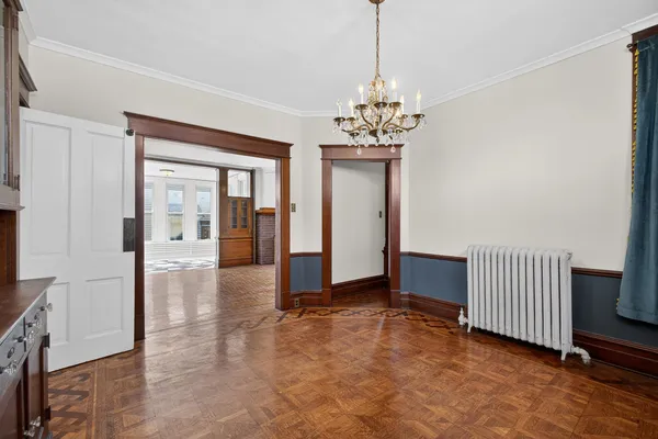 a view of an empty room with a cabinet