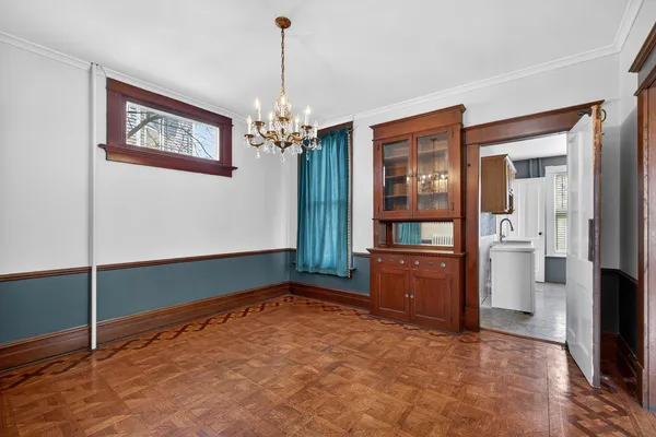 a kitchen with a stove a refrigerator and a sink
