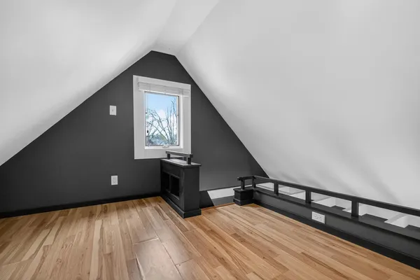a view of an entryway with wooden floor