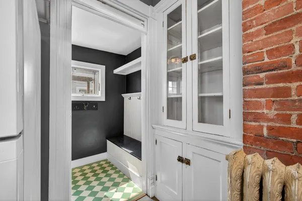 a bathroom with a window and a shower