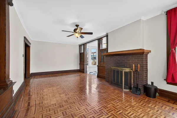 a view of an entryway with wooden floor