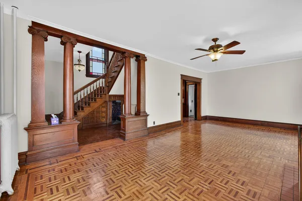 a view of a hallway with wooden walls