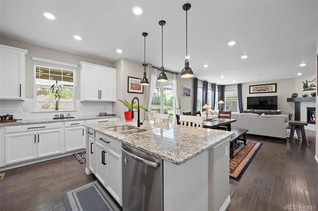 a kitchen with stainless steel appliances granite countertop stove top oven and refrigerator