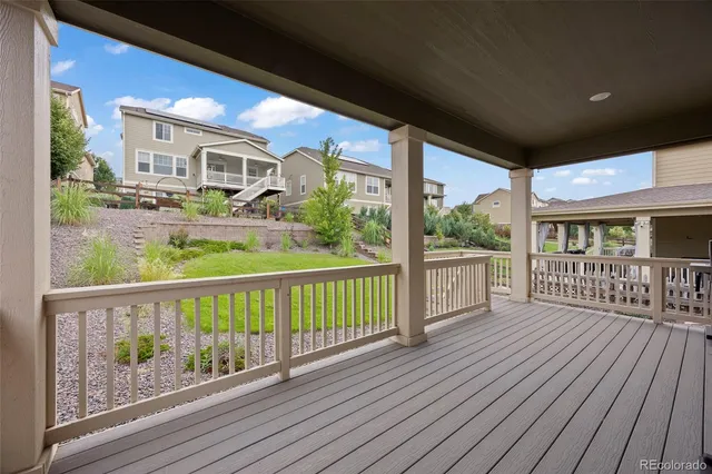 a view of a balcony with wooden floor
