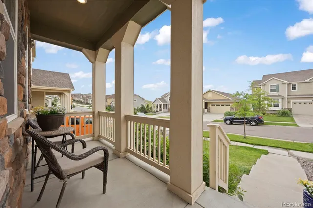 a balcony with chairs