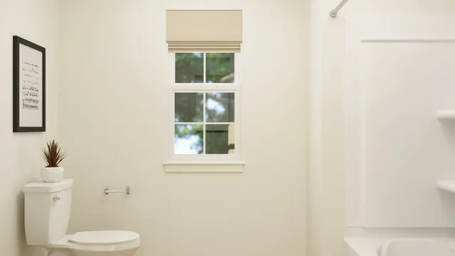 a white toilet sitting next to a bathroom sink