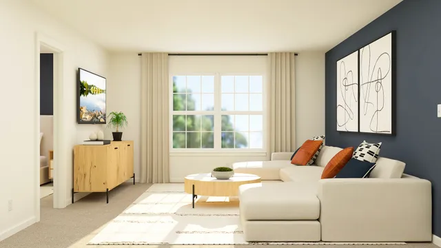 a living room with furniture and large windows