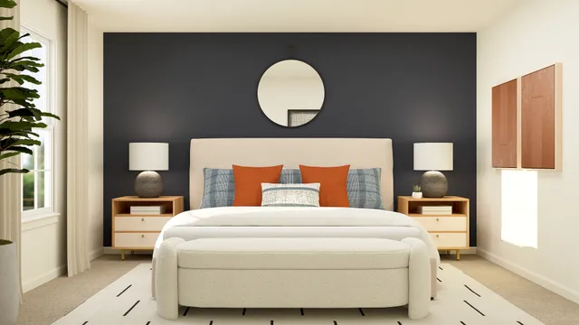 a bedroom with a bed and a painting on the wall