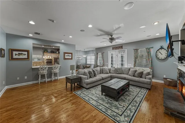 a kitchen with kitchen island a counter top space stainless steel appliances and cabinets