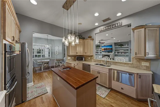 a spacious bathroom with a granite countertop sink mirror and bathtub