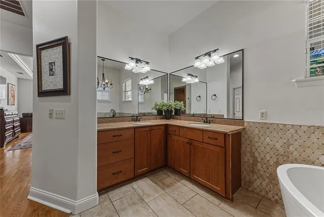 a view of a livingroom with furniture and a floor to ceiling window