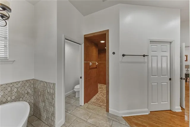 a dining room with furniture and a garden