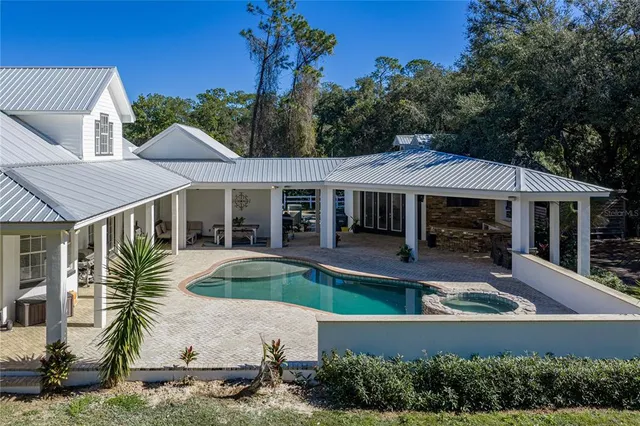 a view of a livingroom with furniture and a chandelier