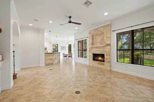 a bedroom with a large bed and a large window
