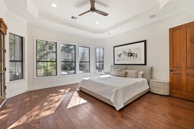 a bathroom with a tub a sink and a large mirror