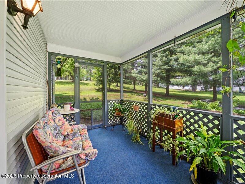 71 Pleasant Avenue Thompson, PA 18465 - Photo 27 of 37 a balcony with furniture and garden view