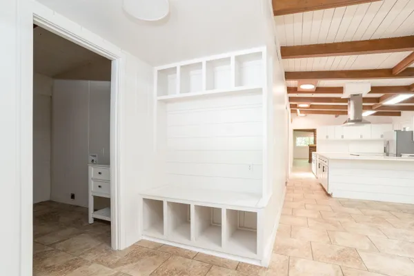 a view of a bedroom with cabinet and a window