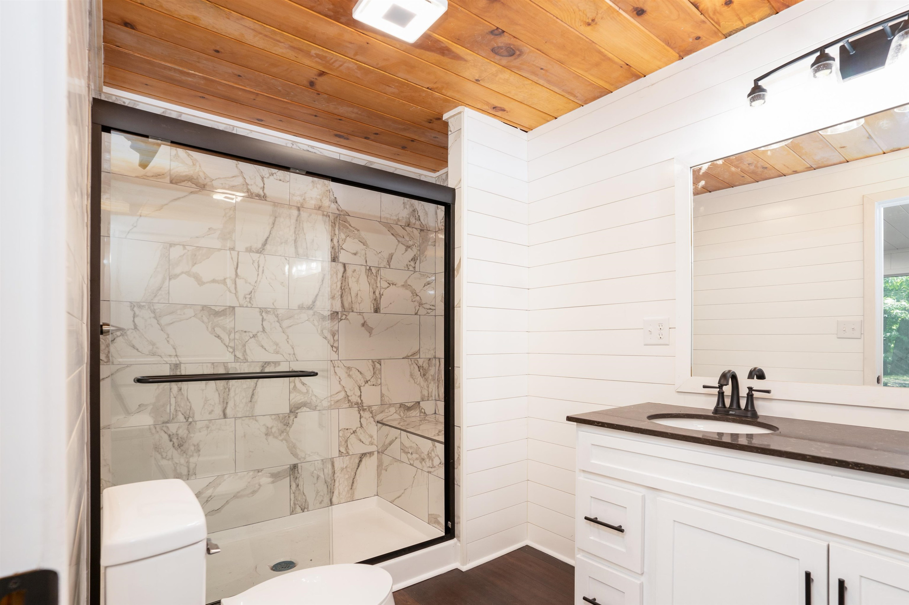 412 Wiley Parker Road Jackson, TN 38305 - Photo 13 of 28 a bathroom with a shower sink and mirror