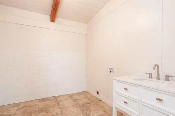 a bathroom with a sink and vanity