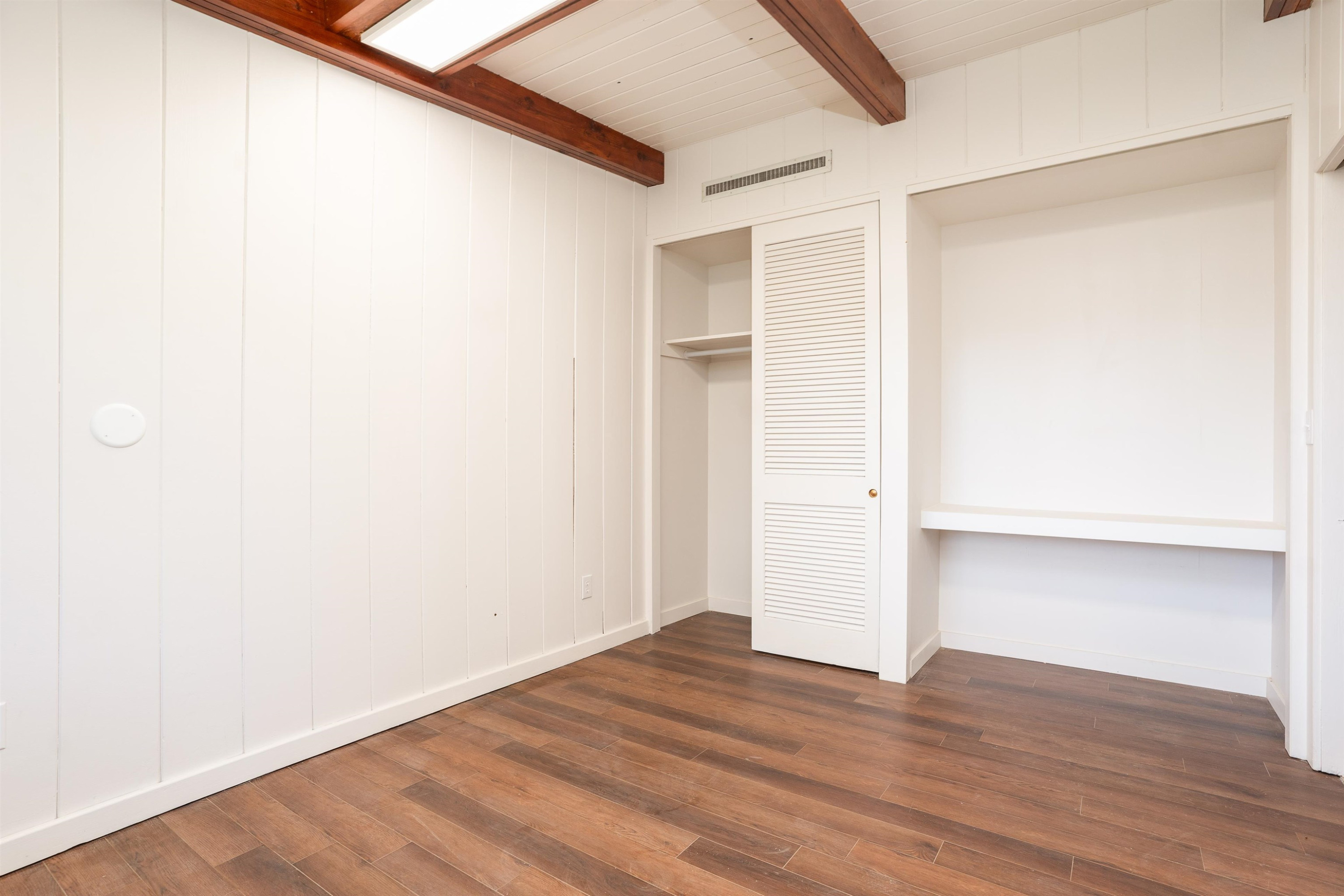 412 Wiley Parker Road Jackson, TN 38305 - Photo 19 of 28 a view of an empty room with wooden floor
