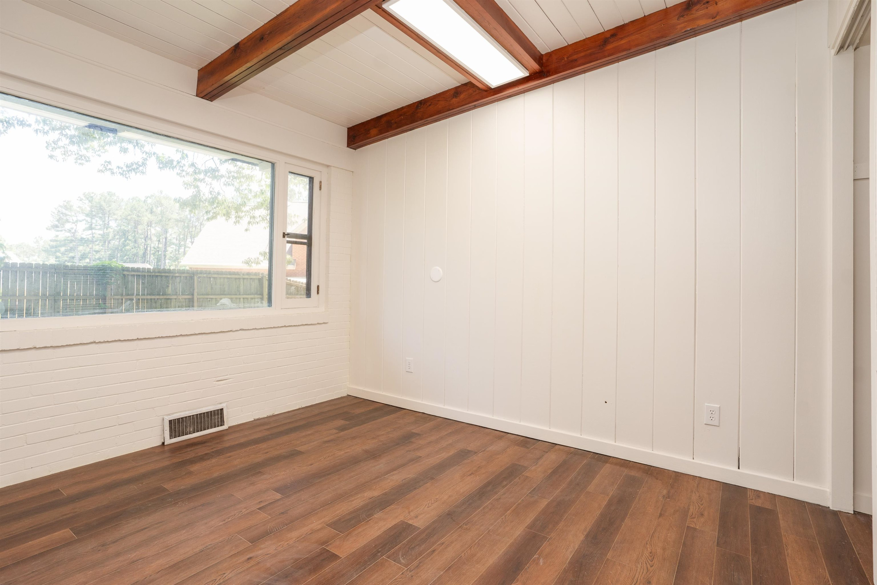 412 Wiley Parker Road Jackson, TN 38305 - Photo 21 of 28 a view of empty room with wooden floor and fan
