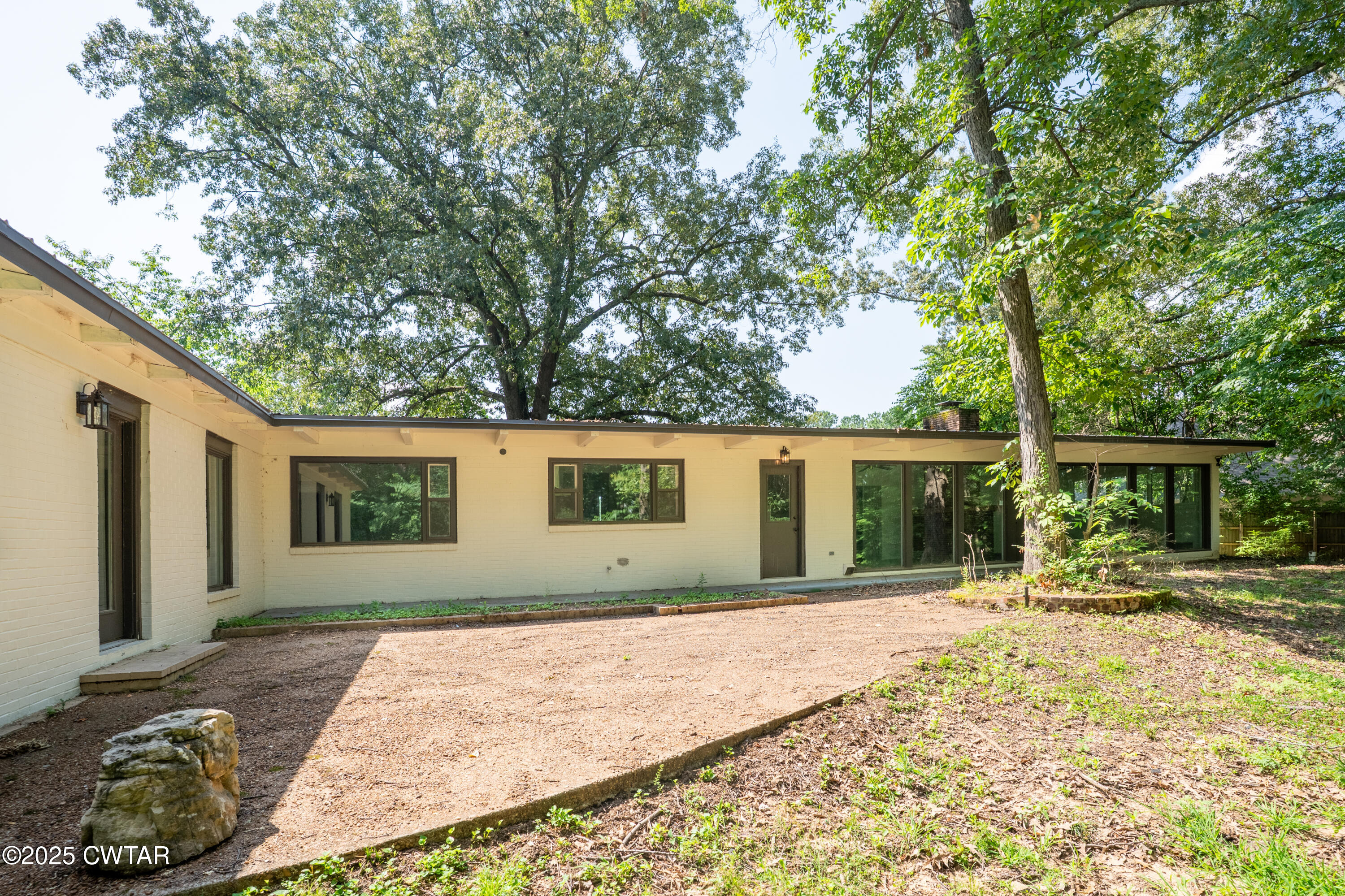 412 Wiley Parker Road Jackson, TN 38305 - Photo 27 of 28 a house with trees in the background