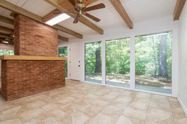 a view of an empty room with windows