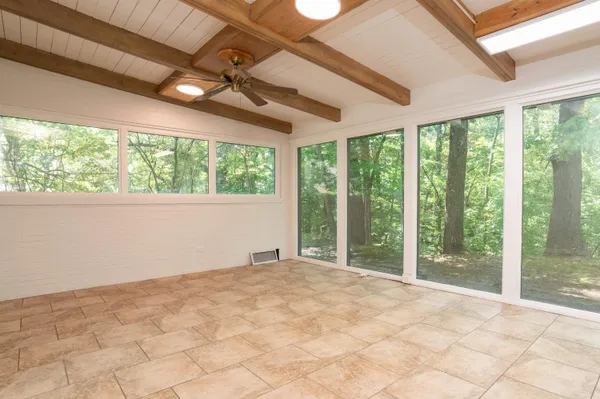 a view of an empty room with a balcony