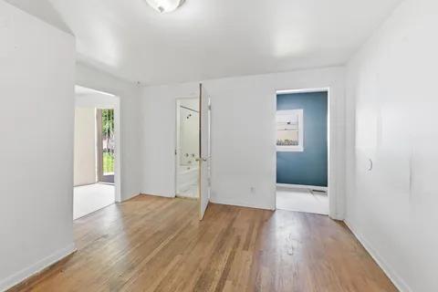 a view of wooden floor in an empty room