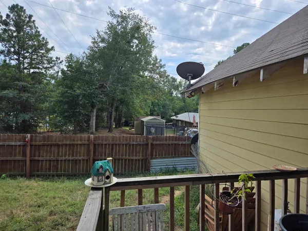 a view of deck with wooden floor and outdoor seating