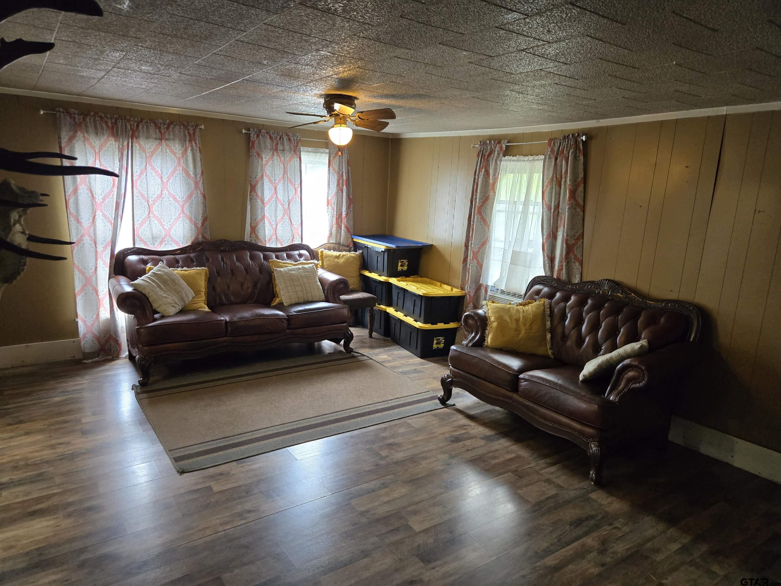 151 Joplin Rusk, TX 75785 - Photo 2 of 17 a living room with furniture and a chandelier