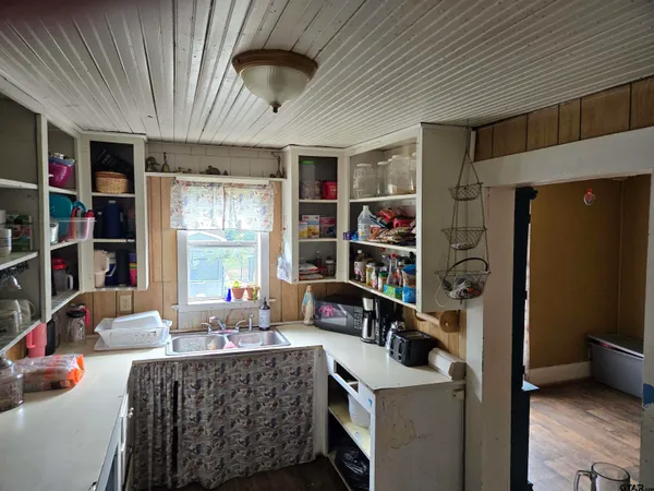 a living room with furniture and a book shelf