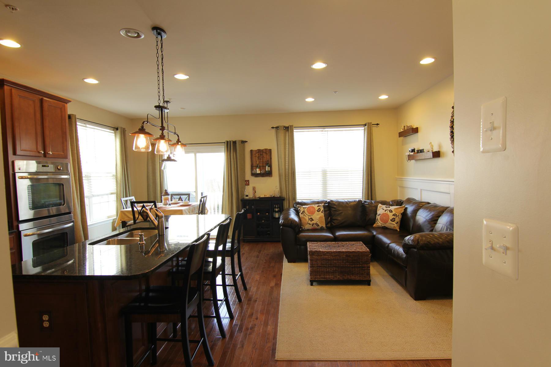 2651 Shade Branch Road Hanover, MD 21076 - Photo 11 of 30 a living room with furniture and a flat screen tv