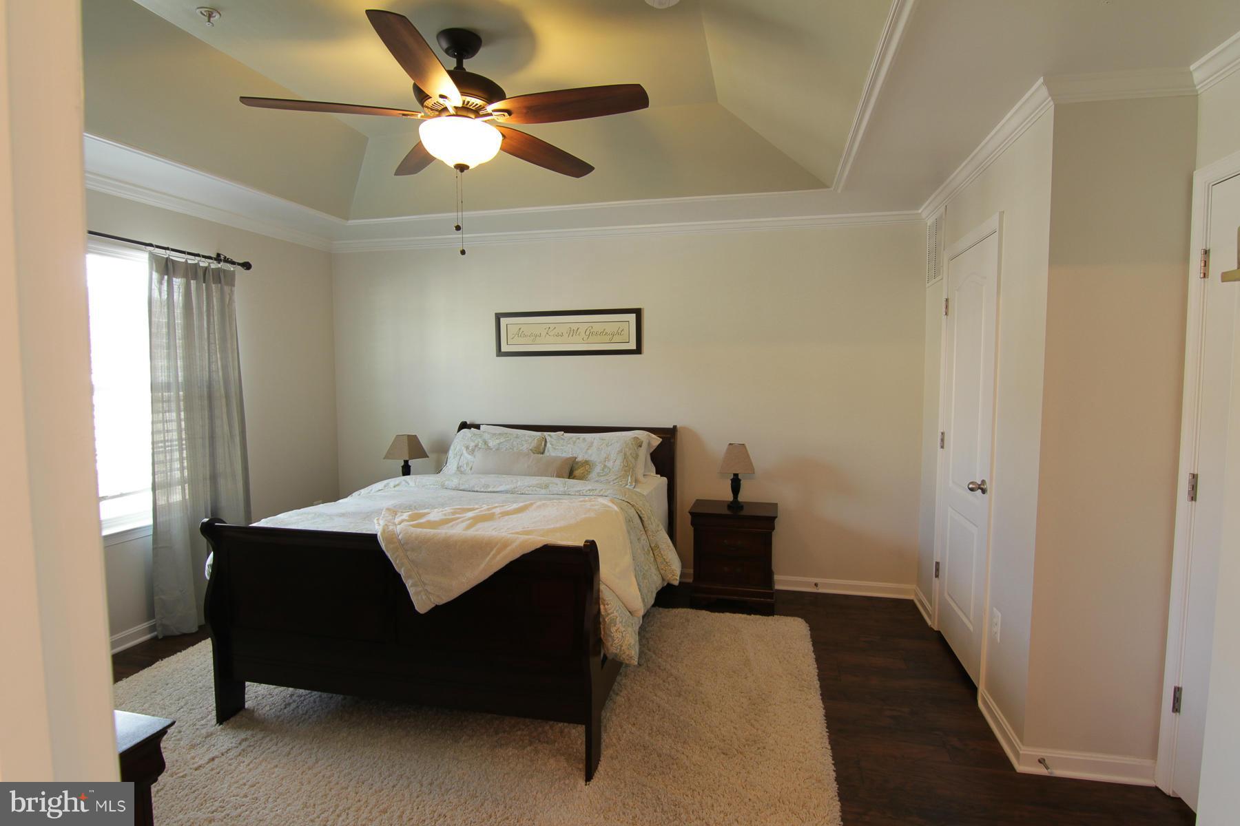 2651 Shade Branch Road Hanover, MD 21076 - Photo 13 of 30 a bedroom with a bed and a ceiling fan