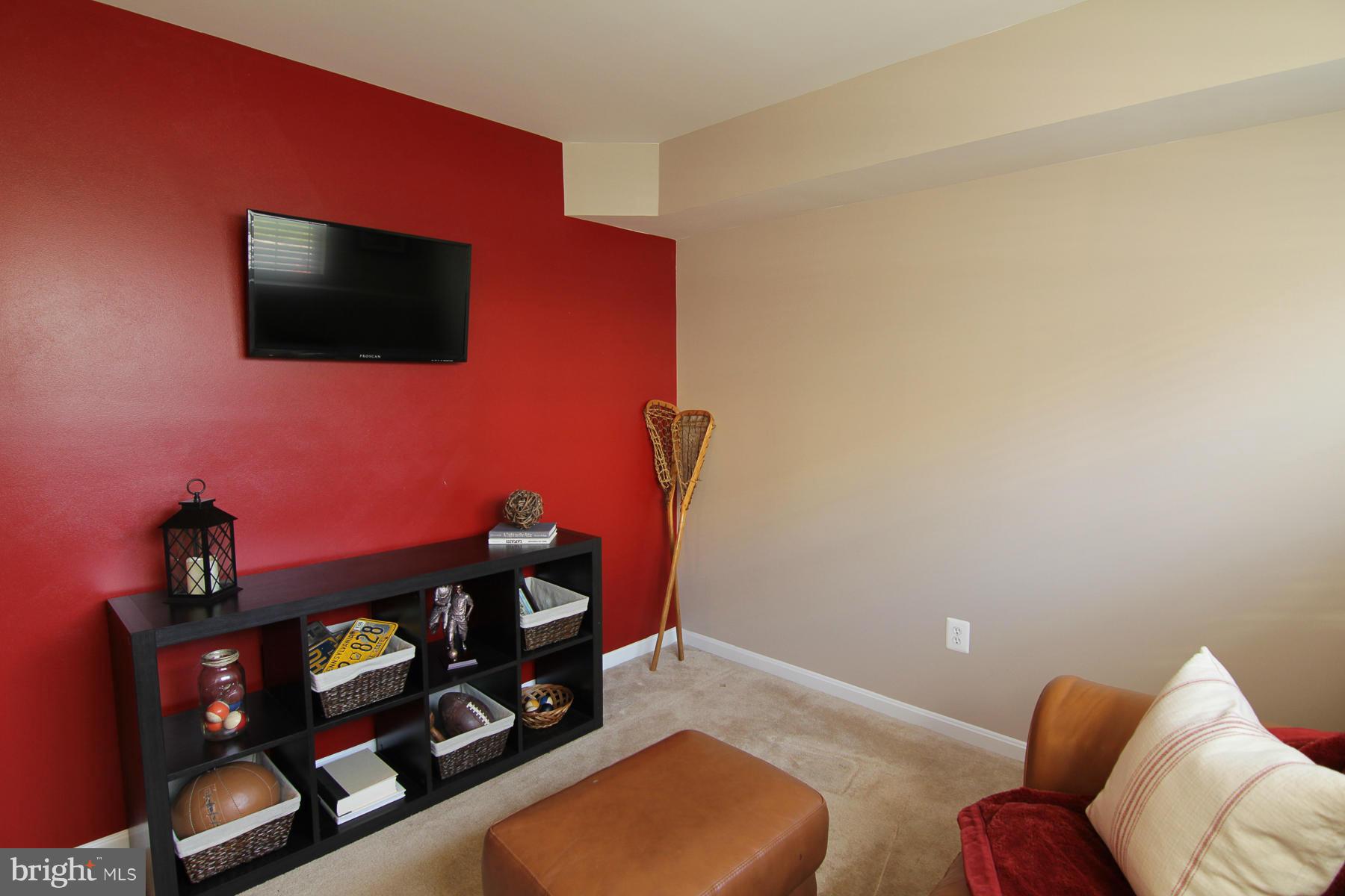 2651 Shade Branch Road Hanover, MD 21076 - Photo 16 of 30 a living room with furniture and a flat screen tv