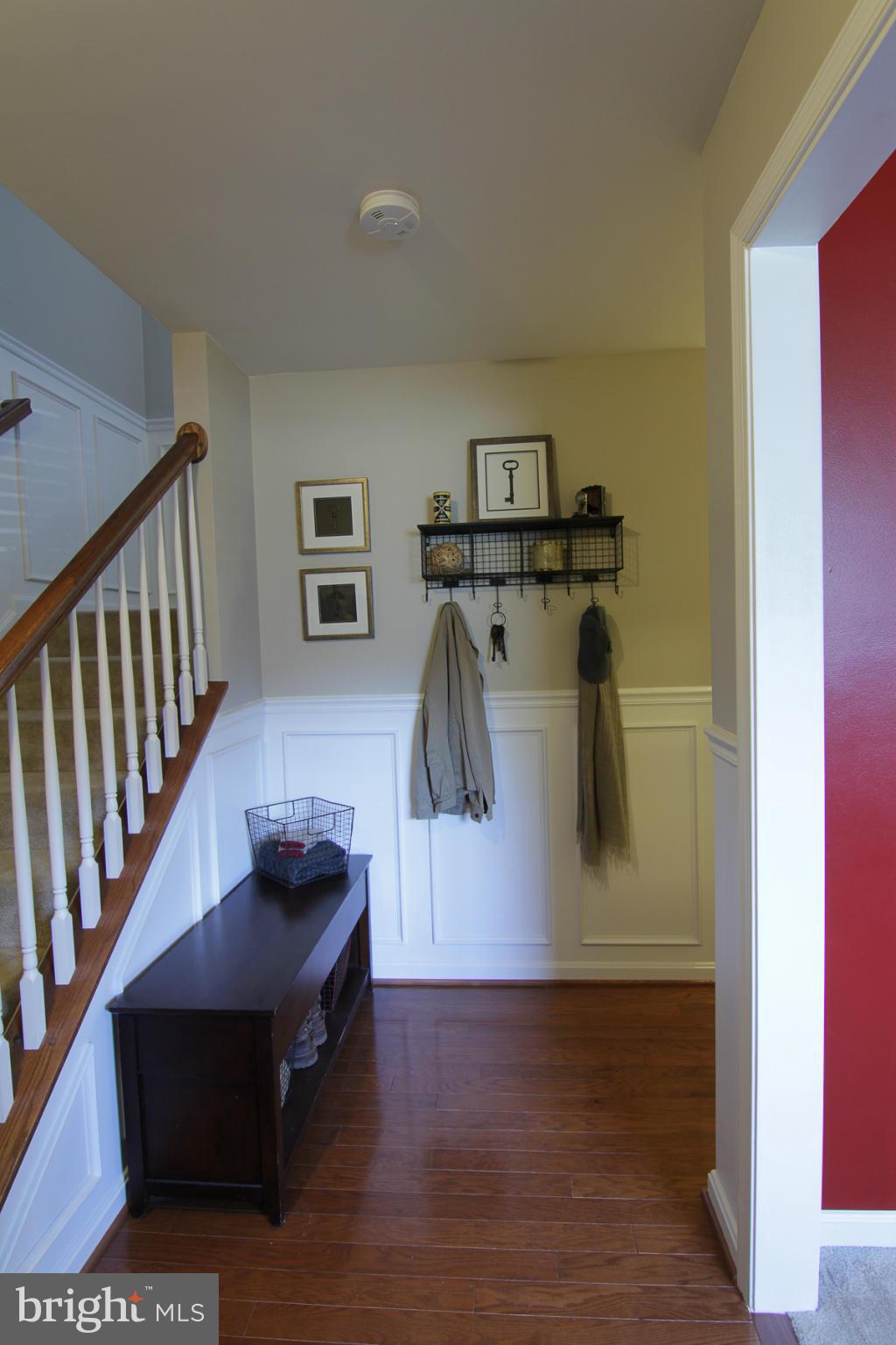 2651 Shade Branch Road Hanover, MD 21076 - Photo 17 of 30 a living room with furniture and a wooden floor