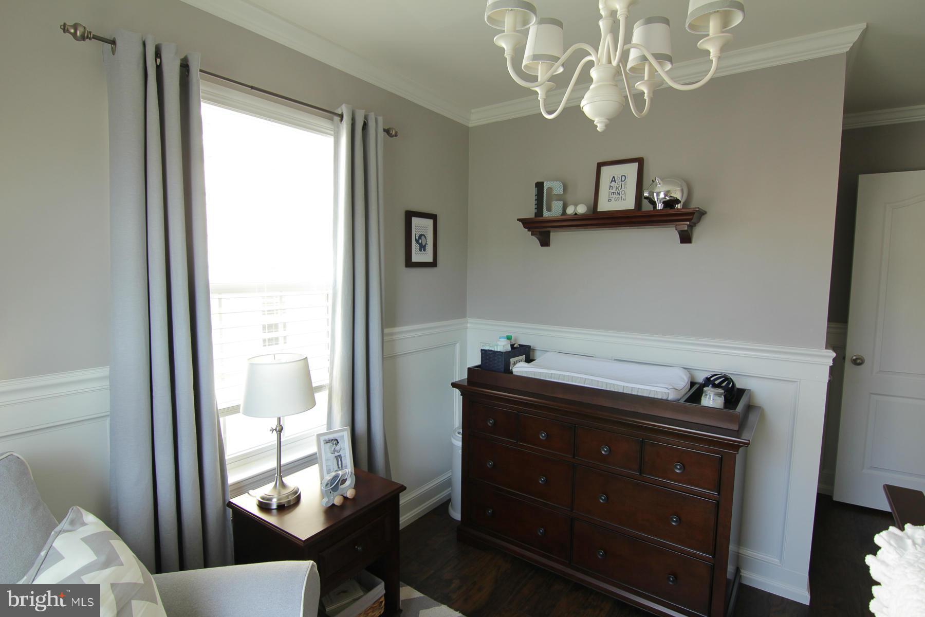 2651 Shade Branch Road Hanover, MD 21076 - Photo 21 of 30 a view of a dining room with furniture and a window