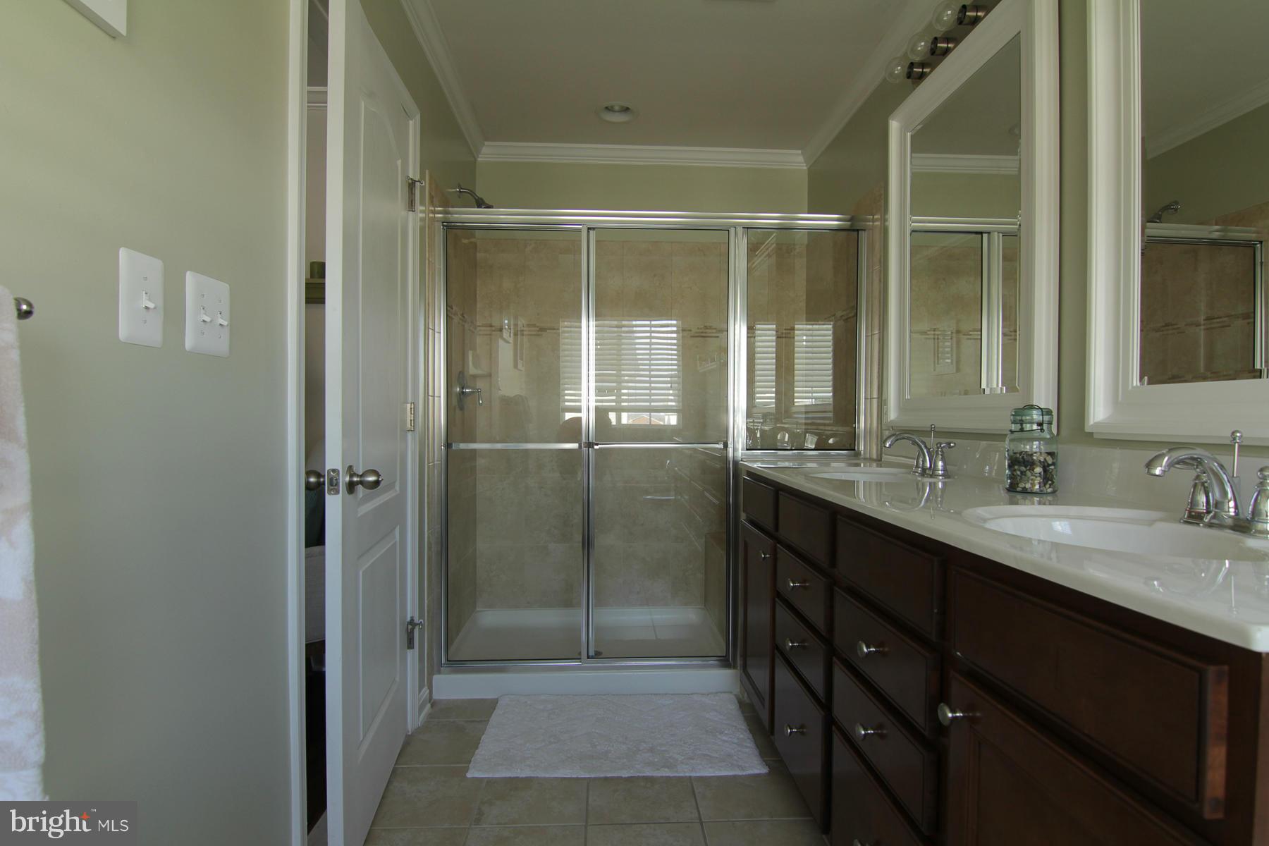 2651 Shade Branch Road Hanover, MD 21076 - Photo 22 of 30 a bathroom with a shower sink vanity granite and mirror