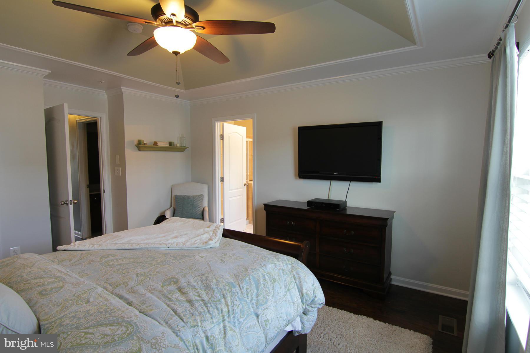 2651 Shade Branch Road Hanover, MD 21076 - Photo 23 of 30 a bedroom with a bed and a flat screen tv