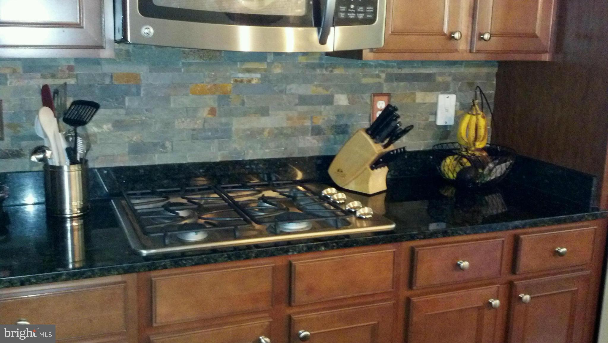 2651 Shade Branch Road Hanover, MD 21076 - Photo 24 of 30 a close view of a stove in the kitchen