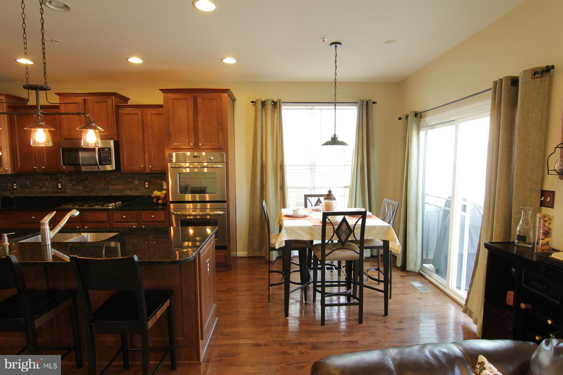 2651 Shade Branch Road Hanover, MD 21076 - Photo 28 of 30 a view of a dining room with furniture window and outside view