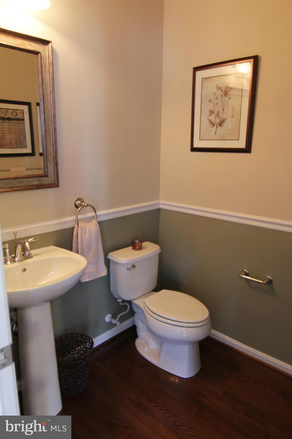 2651 Shade Branch Road Hanover, MD 21076 - Photo 30 of 30 a bathroom with a toilet a sink and mirror