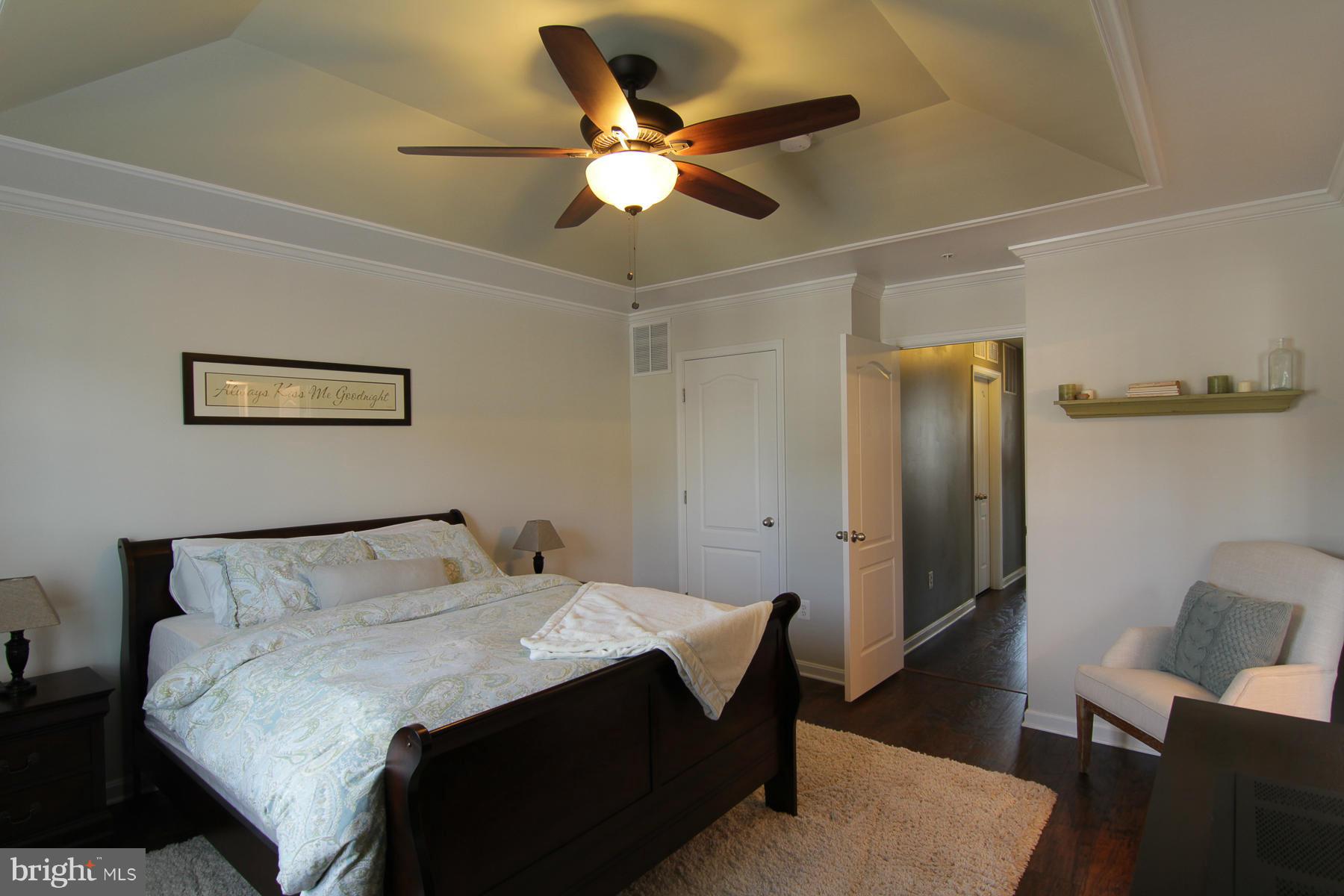 2651 Shade Branch Road Hanover, MD 21076 - Photo 4 of 30 a bedroom with a bed and a table