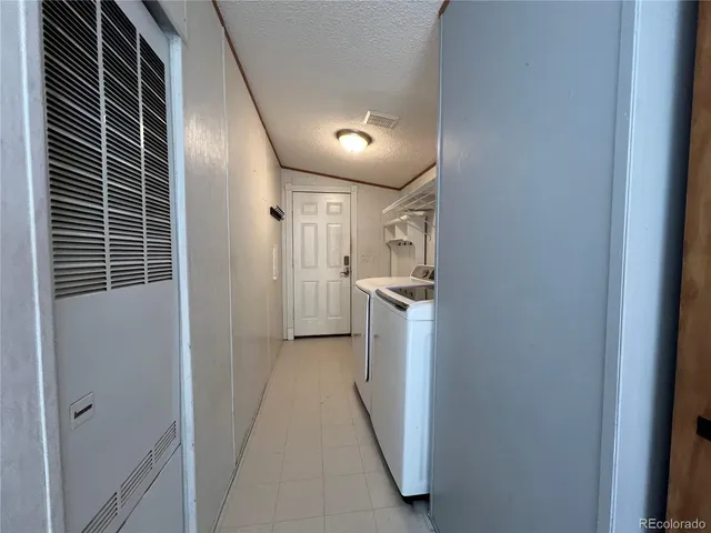 a view of hallway with washer and dryer