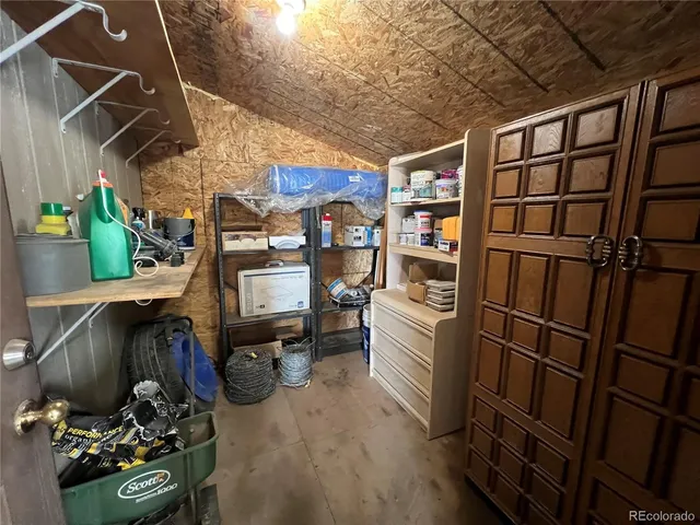 a view of a beach with wooden fence