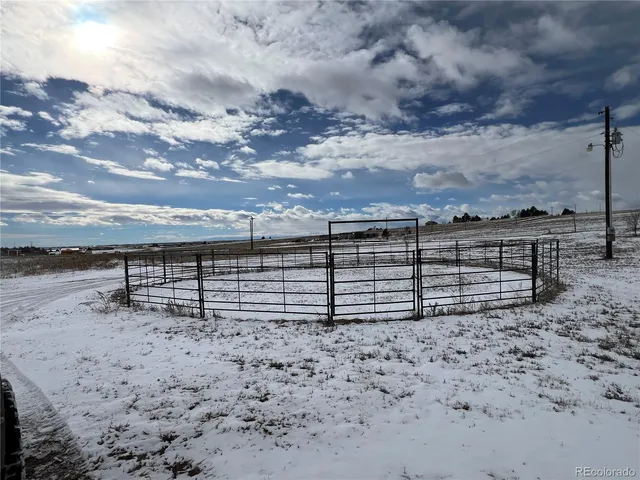 a view of a house with a snow in the background