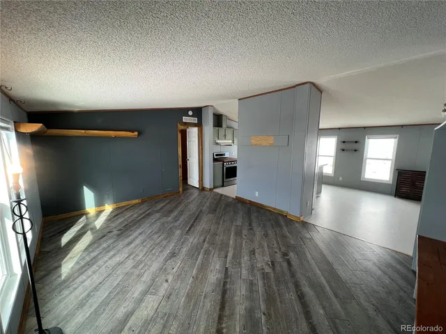 a view of a livingroom with wooden floor